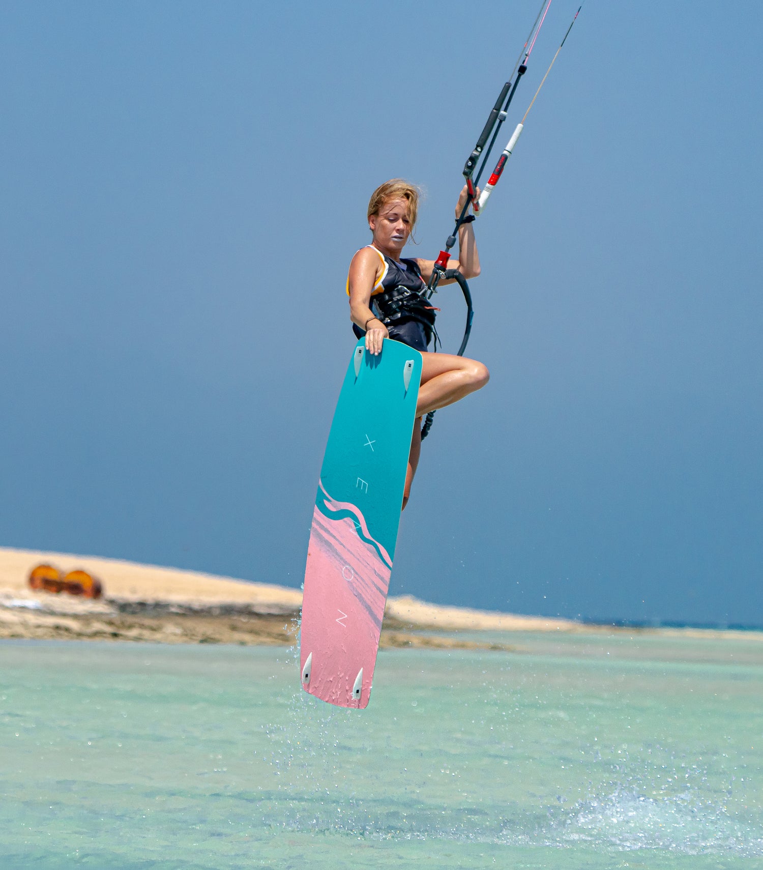 Action picture of the Xenon Boards Women 2024 twintip kiteboard board.